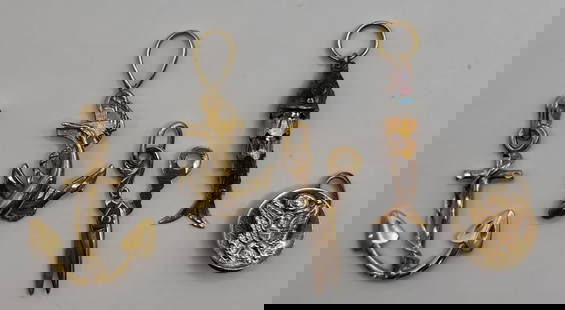 Assortment of 14k Pendants - 9.13g: Assortment of 14k pendants. 9.13g Combined weight. Round pendant with eagle shield. Articulated fish pendant- approx. 1.25"L. 2 - Anchor pendants. Approx. 1.25"L. Scissors pendant. Approx. 1"L.
