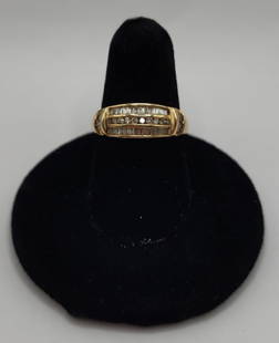 10K .5ct TDW Diamond Band - 3.g TW: 10K Gold diamond band. Three rows of diamonds with diamond accents on each side of rows. Approximately .5ct TDW. 3.6g TW. Size 7.25. Photos are considered part of the condition and description.