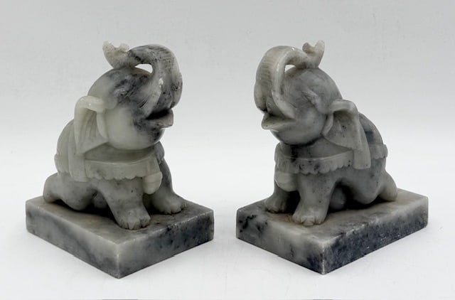 Vintage Hand Carved Soap Stone Elephant Bookends: Vintage hand carved soap stone elephant bookends. Small chip present on backside. Some wear present on one tusk. Approximately 6"h x 3.5"w x 4.75"d. Photos are considered part of the condition and des