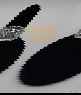 14K Diamond Band - 5.92g TW: 14K Diamond band. Two 0.20ct cut diamonds with small accent diamonds. 5.92g TW. Size 7.75. Photos are considered part of the condition and description. 901-15A