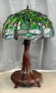 Tiffany Style Leaded Glass Dragonfly Lamp: Beautiful Tiffany style leaded glass dragonfly table lamp. Metal base. 3 Bulb lite with individual pull chains. In working condition. Approximately 28.5"h x 18"w. Photos are considered part of the con
