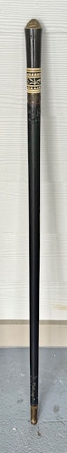 Anglo Indian Colonial Sword Walking Stick: Anglo Indian colonial sword walking stick. Featuring bone and buffalo horn handle, ebonized shaft, and brass lion head ferrule. Blade engraved India. Approximately 35"l. Photos are considered part of
