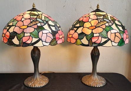 Pr. of Beautiful Tiffany Style Stained Glass Lamps: Pair of beautiful Tiffany style stained glass table lamps. Metal base. Shades feature a hummingbird. In working condition. Approximately 23"h. Photos are considered part of the condition and descripti
