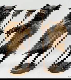 Pair Bronze Bulldog Butler Candle Holders: Pair of bronze bulldog butler candle holders. Painted accents. Imperfection present on one dog toe as seen in photos. Oxidation present. Approximately 14"h x 6"w x 4.5"d and 7.5 pounds each. Photos ar
