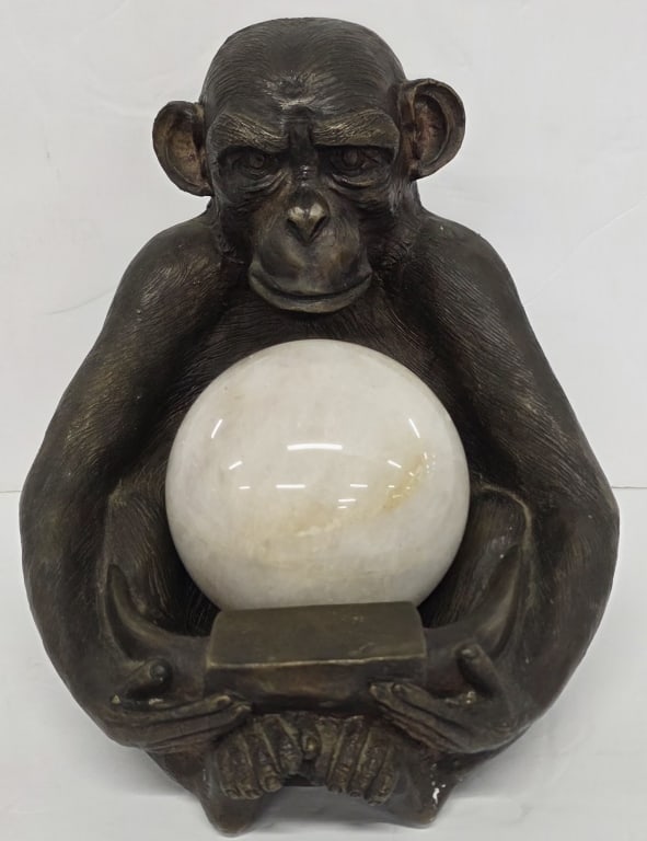 Bronze Chimpanzee & Polished Stone Sculpture: Bronze? chimpanzee sculpture. Sitting holding removable polished stone sphere. Approximately 9"h x 9"w x 10"d. Photos are considered part of the condition and description. 211-3