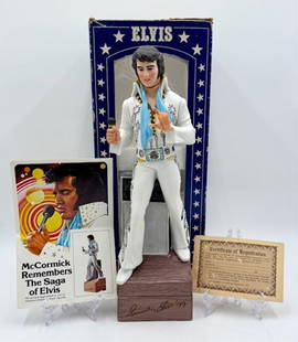 McCormick Elvis Presley Whiskey Decanter Music Box: Vintage 1977 McCormick Elvis Presley whiskey decanter music box. Decanter seal has been broken and container empty. Music box does not wind. Includes original box and certificate of registration. Box