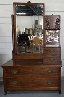 Antique Dressing Table With Mirrors: Antique dressing table with mirrors. Featuring two lower large pull drawers and upper large mirror with two side small drawers and small mirror. On brass casters. In good condition for age with some m