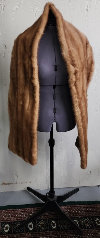 Vintage Marshall Field & Co. Mink Shrug: Vintage Marshall Field Co. caramel mink shrug. Embroidered name and flower on interior. Approximately 79" long x 13" wide. Photos are considered part of the condition and description. 301
