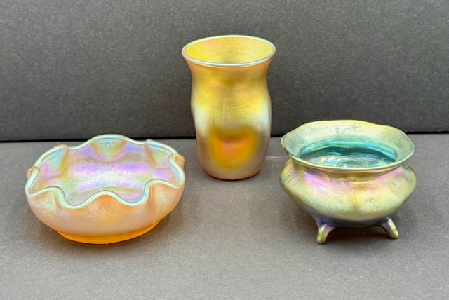 Signed LCT Tiffany Salt Cellars & Toothpick Holder: 3 Pieces of signed LCT Tiffany glass. Louis Comfort Tiffany. Gold iridescent ruffled salt cellar approx. 2.75". Marked LCT 210. Gold iridescent pinched toothpick holder (?). Marked LCT. Approx. 1.5"H