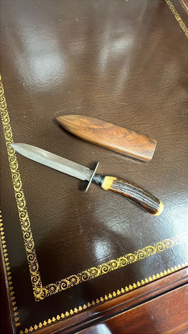 Vintage bone handle hunting knife with wooden sheath: No hallmarks on the blade, unbranded but clearly a nice vintage hunting knife with a matching wooden sheath.