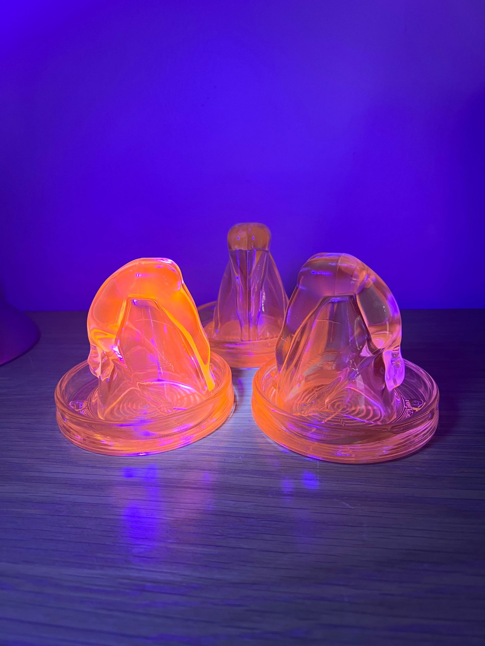 3 "Bottoms Up" Shot Glasses with Coasters - Selenium Glass, UV Reactive, Glows Orange: Mosser Bottoms up Shot Glasses with Coaster. Upside down nude figure prevents you from setting the shot down without taking it. Each comes with a matching coaster with the Mosser Ohio maker mark on th