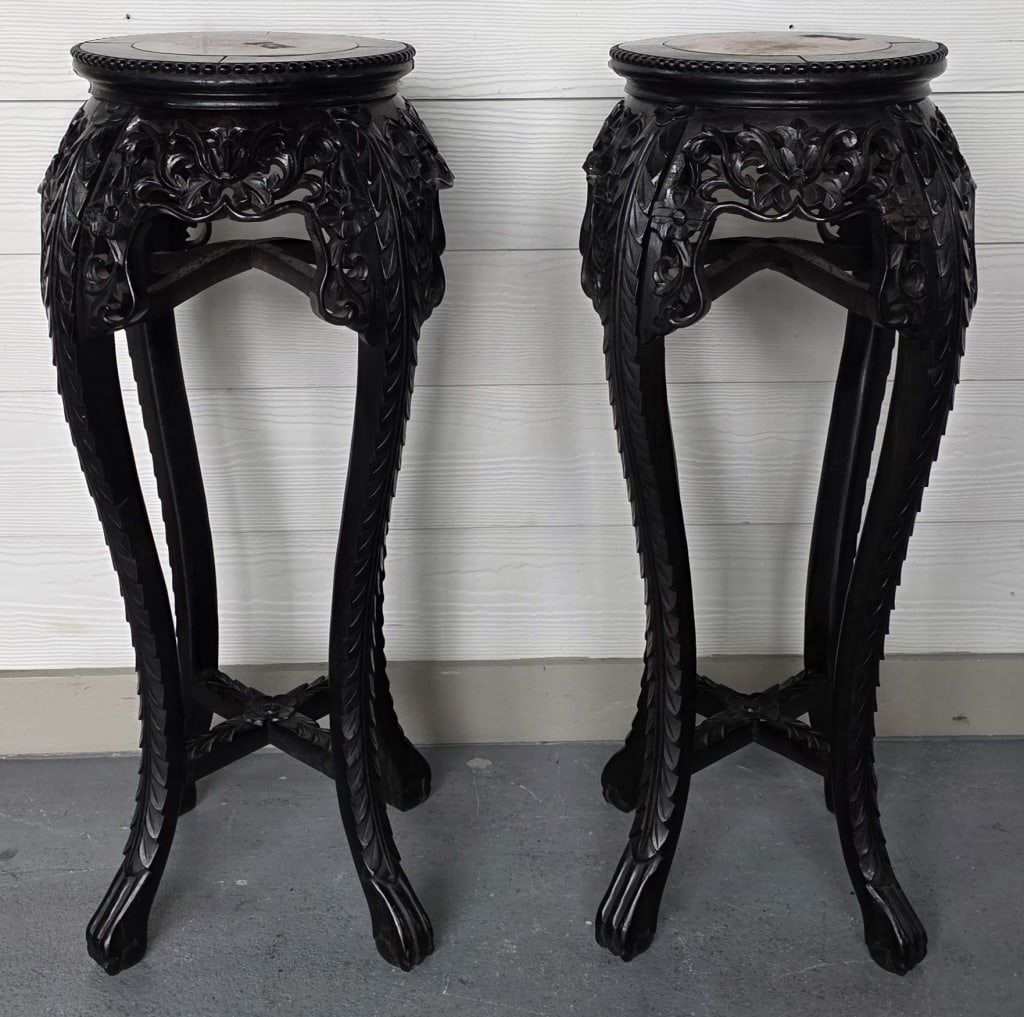 Pr. Carved Rosewood Marble Top Plant Stands: Pair of Asian carved rosewood plant stands. Inset marble tops. Paw feet. Approximately 31"h x 11"dia.. Photos are considered part of the condition and description. 619-12