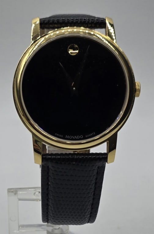 Movado Museum Classic Wrist Watch: Movado Museum Classic wrist watch. Leather band. Quartz battery powered movement. Swiss made. Serial # Mo.0101.34.6002. Photos are considered part of the condition and description. 610-2