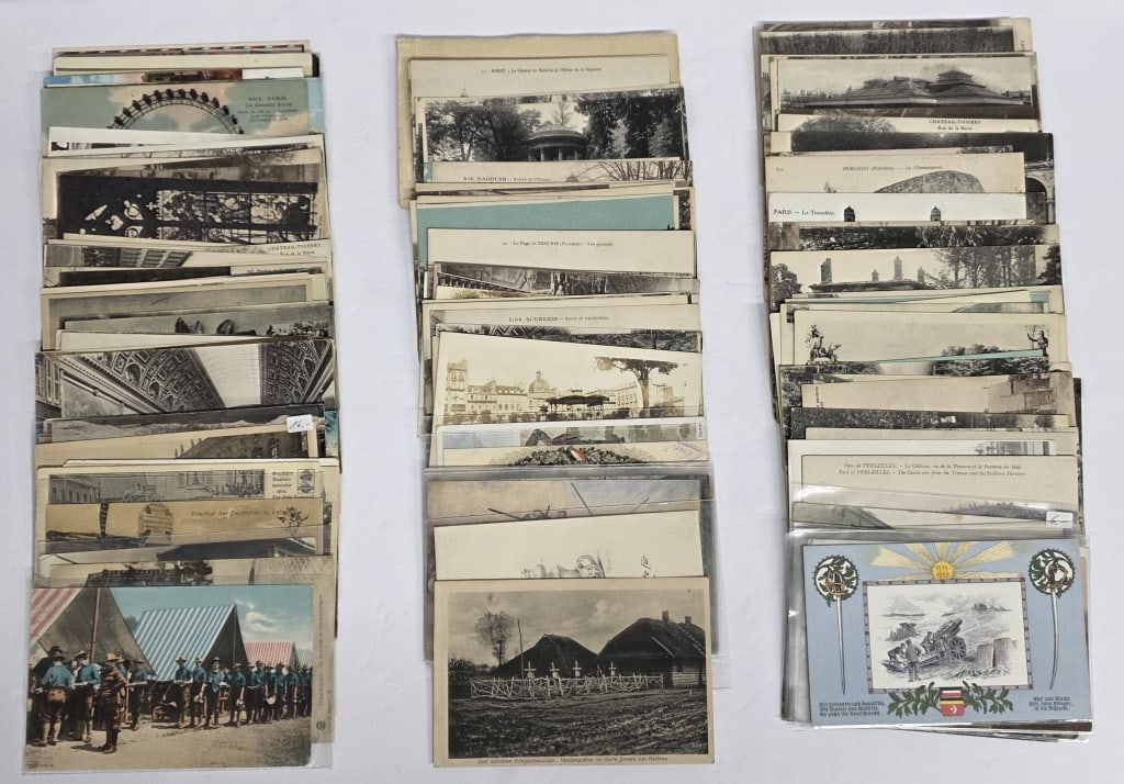 Large Collection of Vintage Postcards: Large collection of vintage postcards. Includes various scenes and locations with most in black and white. Some writing present on some backs. Photos are considered part of the condition and descripti