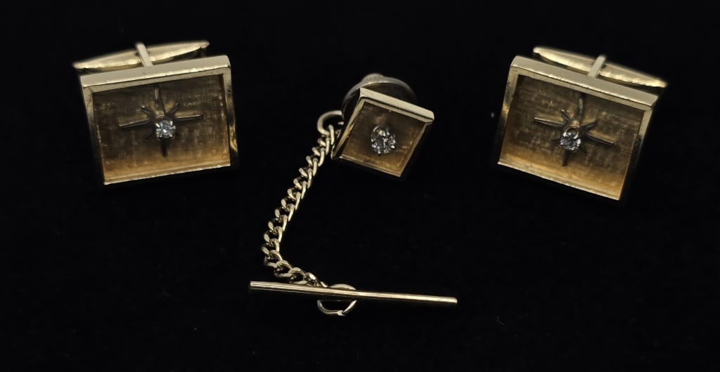 14k Diamond Cufflinks & Tie Tack - 10.79g TW: 14k Diamond cufflinks and tie tack. 10.79g TW combined (tit tack back not included in weight). Pair of cufflinks is rectangular shape with textured face and star design with diamond center. Tie