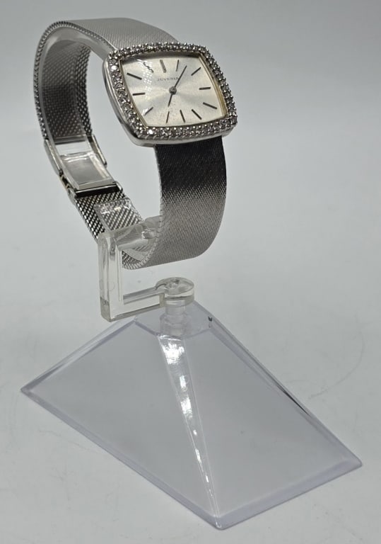 Ladies 18k Juvenia Watch w/Diamond Bezel -71.78gTW: Vintage ladies' white gold Juvenia watch with diamond bezel and integrated mesh band. 71.78g TW. Swiss made. Approx. 8"L x 1.25"W. Multi-position latch closure allows for adjustable sizing.