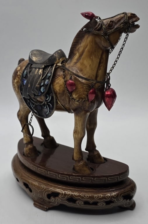 Vinatage Tang Dynasty Style Carved War Horse: Vintage Tang Dynasty style carved war horse. Possibly carved from iv0ry/Bone? Not plastic or wood. Features ornate saddle and harness decorations. Mounted on wood base. Approximately 5.5"h.