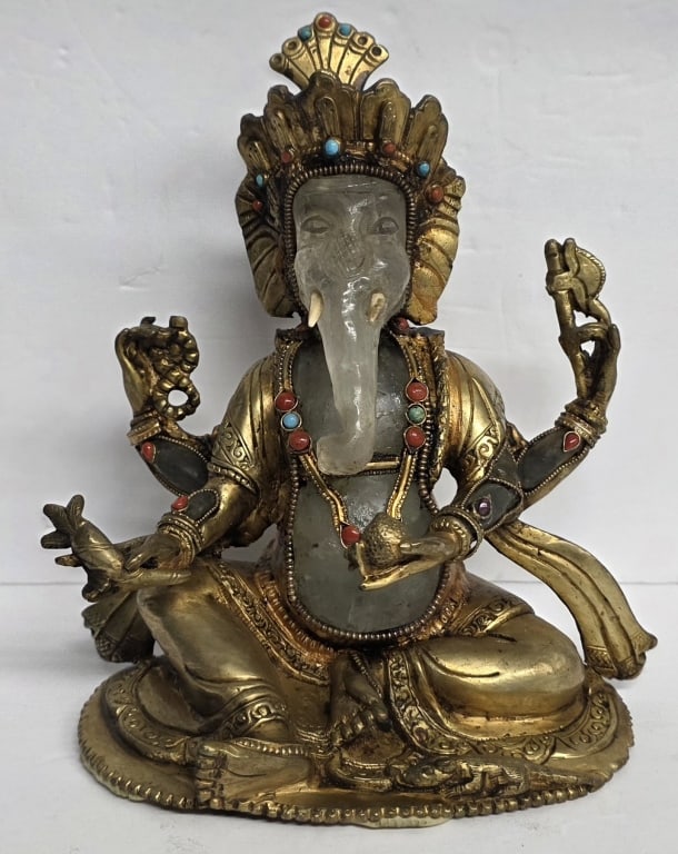 Vintage Crystal & Metal Ganesh Statue: Vintage Tibetan Ganesh statue. Crafted from copper? with a body carved from a large piece of clear quartz crystal. Embellished with small turquoise and red coral stones. Approximately 7.5"h. Photos ar