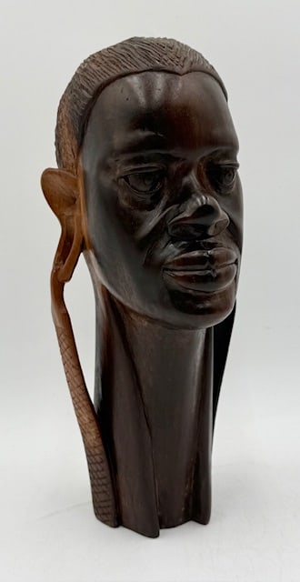 Vintage Hand Carved Wooden African Bust: Vintage African bust. Hand carved from a single piece of ebony? or ironwood? wood. Features intricate details, especially in the hair and the elongated earlobe with earrings. Approximately 12.5"h. Pho