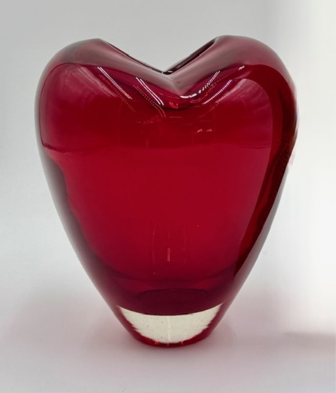 Murano Style Red Art Glass Heart Vase: Murano style red art glass heart vase. Hand blown. Small internal glass imperfection present. No chips or cracks. Approximately 7"h x 6"w. Photos are considered part of the condition and description.