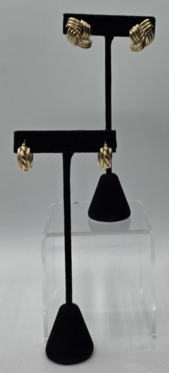 Pair of 14k Gold Hoop Earrings - 10.55g CTW: Two pairs of 14k gold hoop earrings. Includes pair of love knot design earrings with omega backs, 6.55g TW and approximately 1" x 1", and pair of twisted rope design earrings with snap top backs, 4.0g