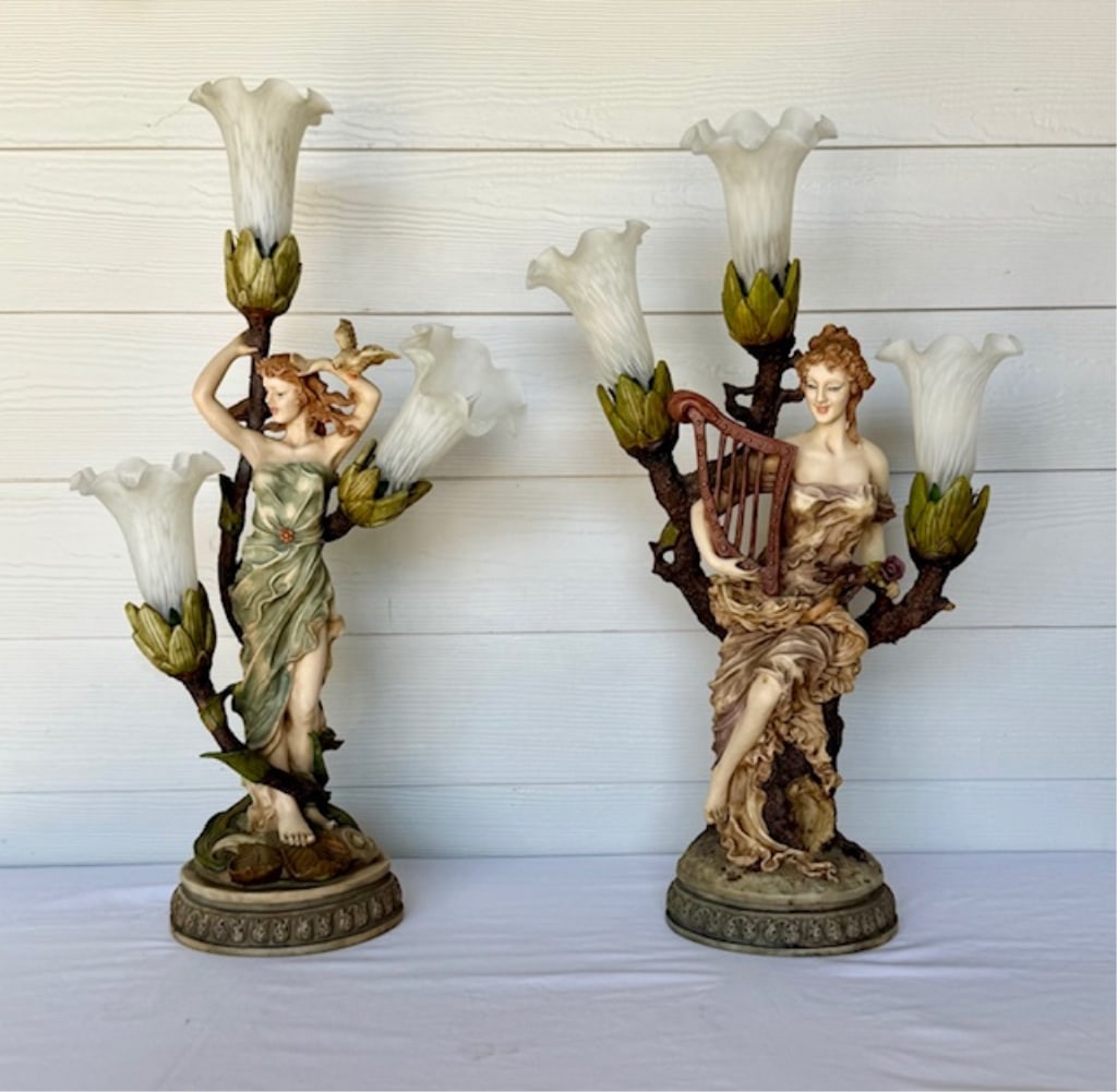 Pair of Vintage Figural Candelabra Table Lamps: Pair of vintage figural candelabra table lamps. Designed in the art nouveau style after L & F Moreau. Includes 27.5"h x 15"w female with bird and 26.75" x 16" female with harp. Composite material. Sma