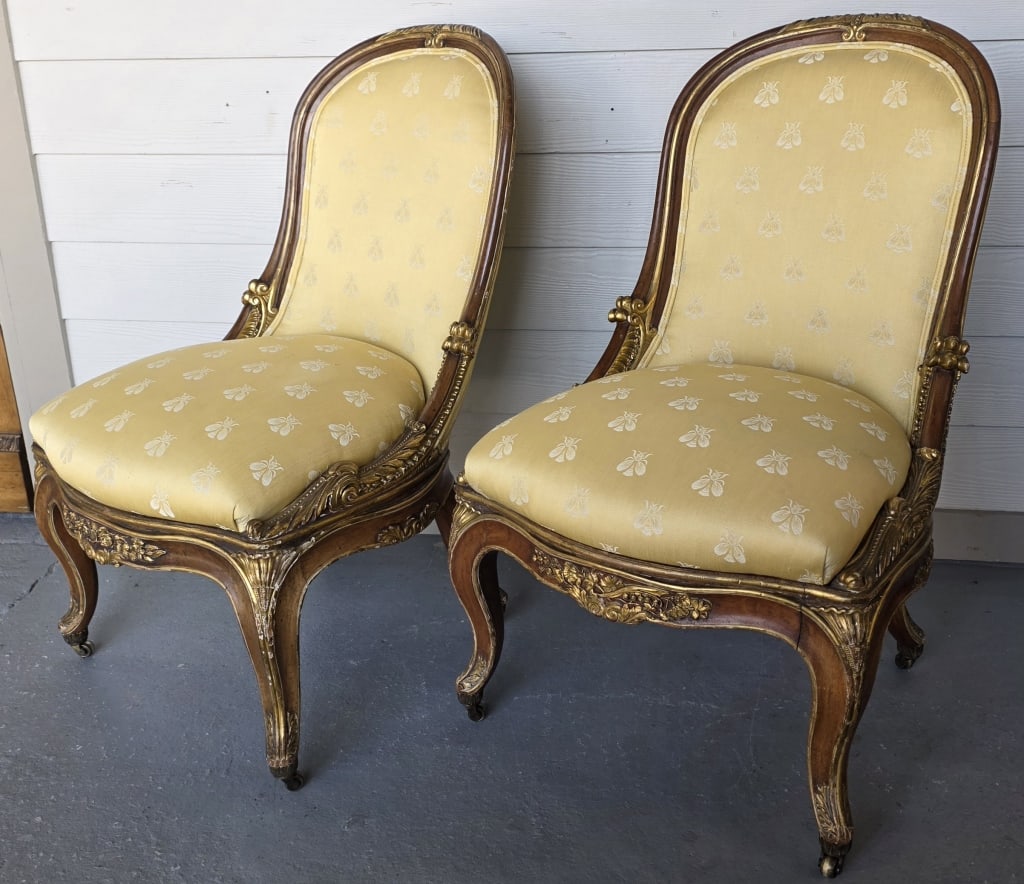 Pair 19th Century Louis XV Style Gilt Wood Chairs: Pair 19th century Louis XV style gilt-wood side chairs. The frames feature intricate carvings, cartouche shaped back, and curving cabriole legs with a gilt finish. Brass castors. In good condition for