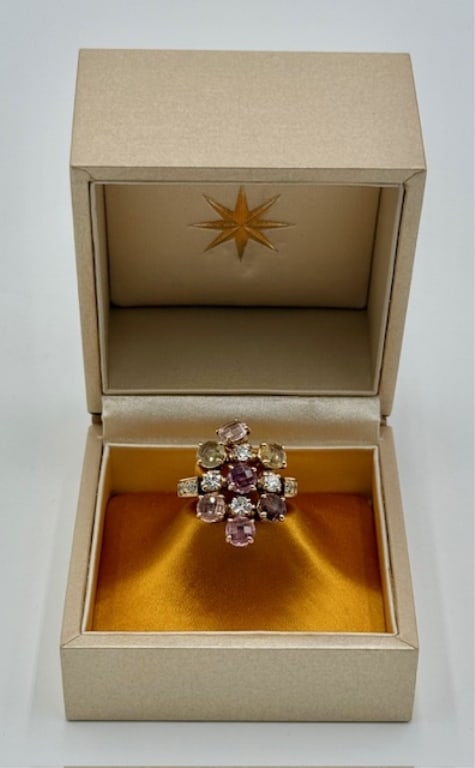 18k Bvlgari Multi Gemstone Ladies Ring - 8.06g TW: 18k Bvlgari multi gemstone ladies ring. From the "Allegra" collection. Yellow gold set with 7 double rose cut pastel sapphires and 10 round diamonds. Hinged setting. Approximately 8.06g TW and size 5.