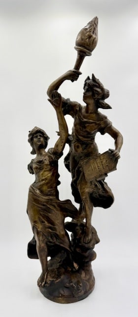 Vintage L.F Moreau Bronze Statue: Vintage L.F. Moreau bronze statue. The sculpture depicts two allegorical female figures, one holding a torch and the other a book or tablet. Hollow cast. Heavy. Approximately 24"h x 6" round base. Pho