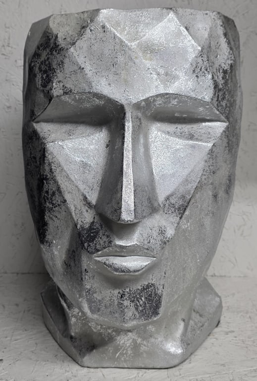 Modern Abstract Face Planter: Modern abstract face planter. Made of a composite/resin material. Metallic silver finish. Approximately 17.5"h. Photos are considered part of the condition and description. 211-17