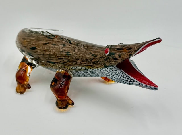 Hand Blown Murano Art Glass Crocodile: Hand blown Murano art glass crocodile. Hand made using the lampwork technique. Crocodile features intricate details like an open red mouth, red eyes, and a speckled brown/amber body with gold glitter