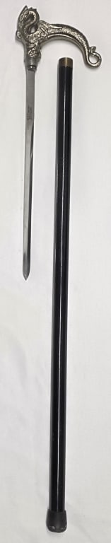 M&F Dragon Sword Cane: M & F dragon sword cane. Silver finish handle with black finish aluminum cane body and rubber tip. Made in Pakistan. Approximately 35"long. Photos are considered part of the condition and