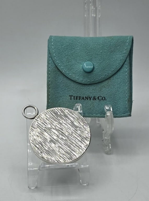 Vintage Tiffany & Co. Sterling Compact Mirror: Vintage Tiffany & Co. sterling silver compact mirror. Includes original pouch. In good condition for age with some age marks on mirror. Mirror approximately 2". Photos are considered part of the