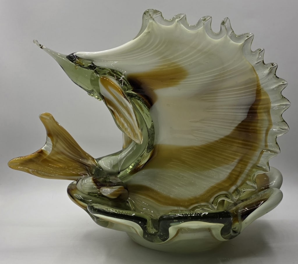 MCM Murano Style Hand Blown Art Glass Sailfish: MCM Murano style hand blown art glass sailfish sculpture. Features a leaping sailfish/swordfish attached to a shallow dish. Flowing colors of greens, browns, and whites. Approximately 9"h x 9"dia. Pho