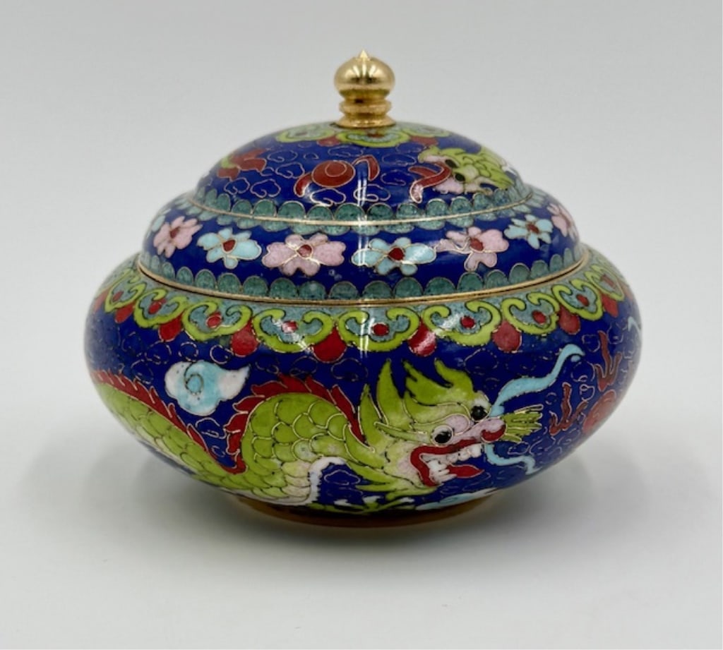 Vintage Chinese Cloisonne Enamel Trinket Bowl: Vintage Chinese cloisonne enamel lidded trinket bowl. Design features a green dragon on a blue background. Approximately 4"h x 5.5"w. Photos are considered part of the condition and description. 505-4
