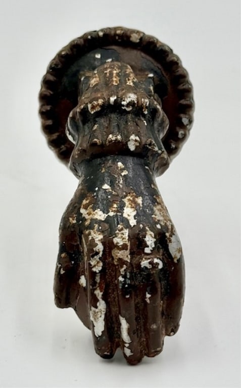Antique Iron Hand Door Knocker: Antique iron hand door knocker. It features a decorative cuff design. In aged condition with some paint missing and patina. Approximately 5" x 2.5". Photos are considered part of the condition and des
