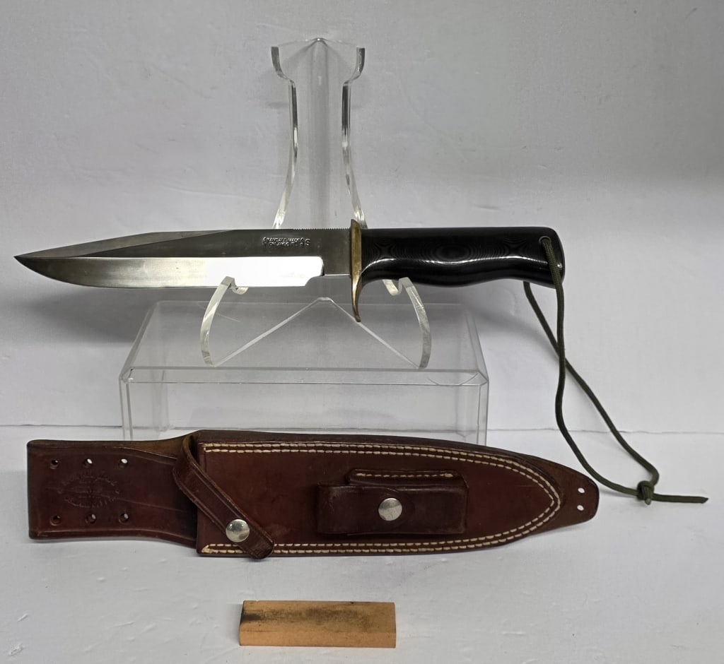 Custom Randall Made Model 14 "Attack" Knife: Custom Randall Made model 14 "Attack" knife. Knife features black micarta Border Patrol shape handle, standard brass single hilt, and stainless steel blade. Extra heavy wide tang extends through a cha