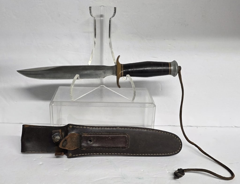 Rare Randall WW2 Model 1 Fighting Knife: Rare Randall made SPFLD. MASS. (Springfield) knife, World War Il era (circa 1943-1945) version of the Model 1 Fighting Knife. Knife features carbon steel blade, stacked leather handle, and brass guard