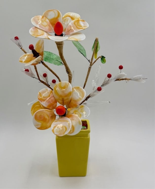 Vintage Hand Crafted Glass Flower Table Lamp: Vintage hand crafted glass flower table lamp. Features delicate glass flowers hand wired to branches in a yellow flower pot. Two orange bulb lights. Some chips and crazing present on yellow pot base.