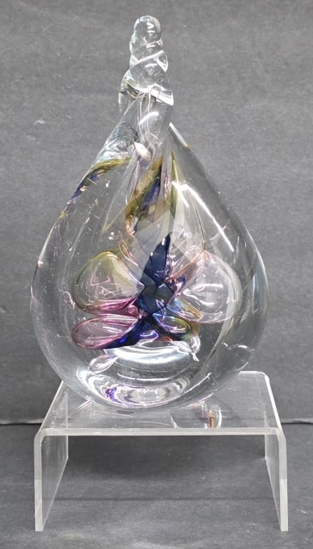 Adam Jablonski Handcrafted Art Glass Paperweight: Adam Jablonski handcrafted art glass paperweight. Beautiful teardrop twist-top shape with a swirled core of blue, purple, green, and pink. Signed. Approximately 6"h. Photos are considered part of