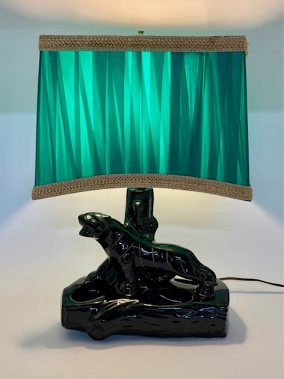 Vintage MCM Ceramic Panther Lamp & Planter: Vintage mcm ceramic panther lamp. Features a glossy black glazed panther sculpture with an integrated planter box in the base. Panther features some painted details including eyes. Green vinyl shade i