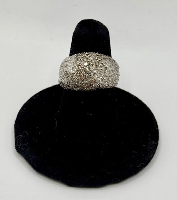 14k White & Brown Diamond Cocktail Ring - 9.31g TW: 14k Diamond cocktail ring. Round cut white diamonds on each side of a center wave of round cut brown diamonds. 9.31gTW. Approx. size 6.5. Photos are considered part of the description and