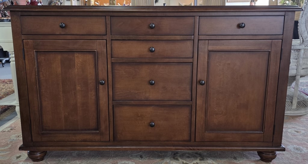 Pottery Barn Mahogany Laurel Sideboard: Pottery Barn Laurel mahogany sideboard/buffet. Includes six drawers and two doors. Approximately 39"h x 65"w x 21.5"d. Photos are considered part of the condition and description. R