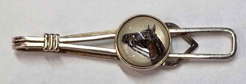 Vintage 10k Equestrian Tie Clip - 3.43g TW: Vintage equestrian themed tie clip. Features a painted? horse head portrait under convex glass? Approximately 1.75" long and 3.43g TW. Photos are considered part of the condition and description. R