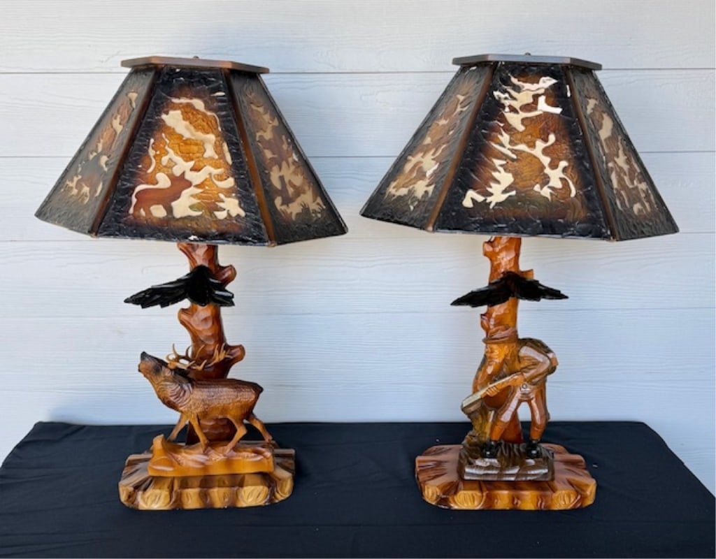 Pr. Vtg. German Black Forest Carved Wood Lamps: Pair of vintage German Black Forest carved wood table lamps. Each lamp features a hand carved wood base depicting a tree stump and stag and hunter. Original hand carved pierced wood silhouette shades