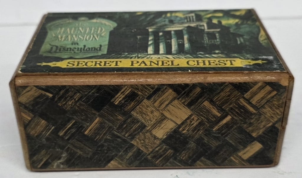 Vintage Haunted Mansion Secret Panel Chest: Vintage Haunted Mansion secret panel chest. The box features a wooden construction with a woven wood pattern on the exterior. Seven steps to open the secret panel. Instructions included.