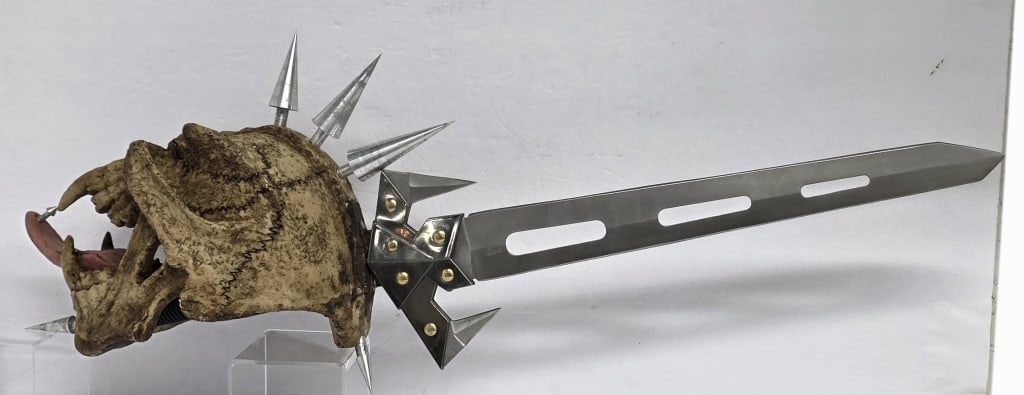 Tom Anderson Spikester Sword: Spikester Sword designed by Tom Anderson for Master Cutlery. Fantasy weapon features a 16" stainless steel blade with three stylish rectangular cutouts and three smaller blades integrated into its