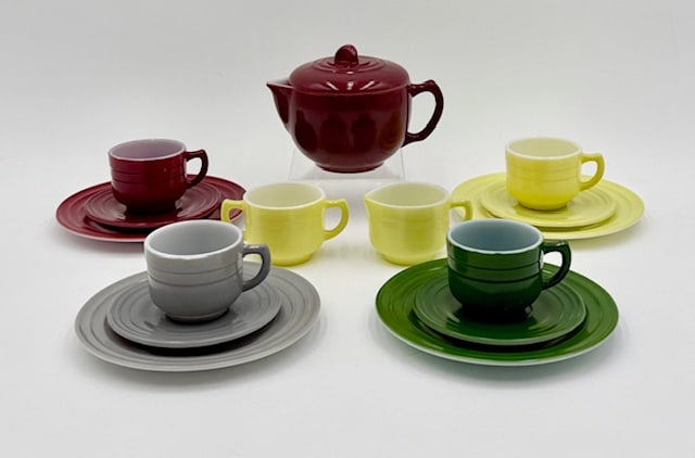 Vintage Hazel Atlas Little Hostess Child's Tea Set: Vintage Hazel Atlas Little Hostess child's tea set. Made of colored platonite glass. Includes 4" red teapot, 1.75" yellow cream and sugar, and 4 complete tea settings; red, grey, green, and