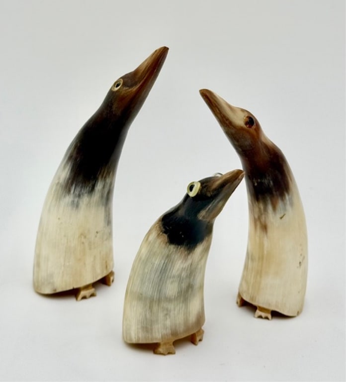 3 Carved Horn Penguin Figures: 3 Carved horn penguin figures. All feature carved accents for the feet and applied eyes. Sizes range from approximately 3.5" to 5". Photos are considered part of the condition and description.