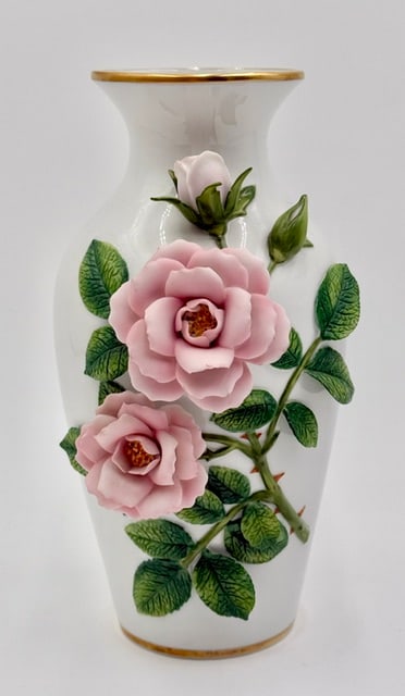 Rosanne Sanders Celestial Rose Vase: Celestial Rose vase designed by Rosanne Sanders. Designed for Franklin Mint. Made of fine white porcelain and features hand painted and sculpted pink roses with green leaves. Rim and base are trimmed 